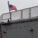 USS SIOUX CITY WITH FLAG