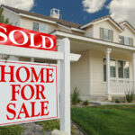 Home For Sale Sign in Front of Beautiful New Home