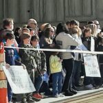 FAMILY WAITING FOR ARMY GUARD